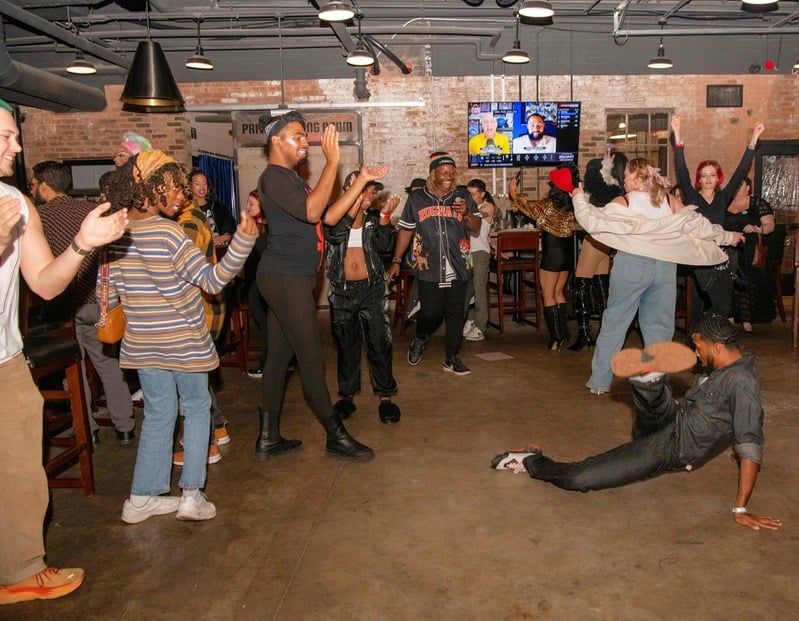 Community members dancing at a gathering